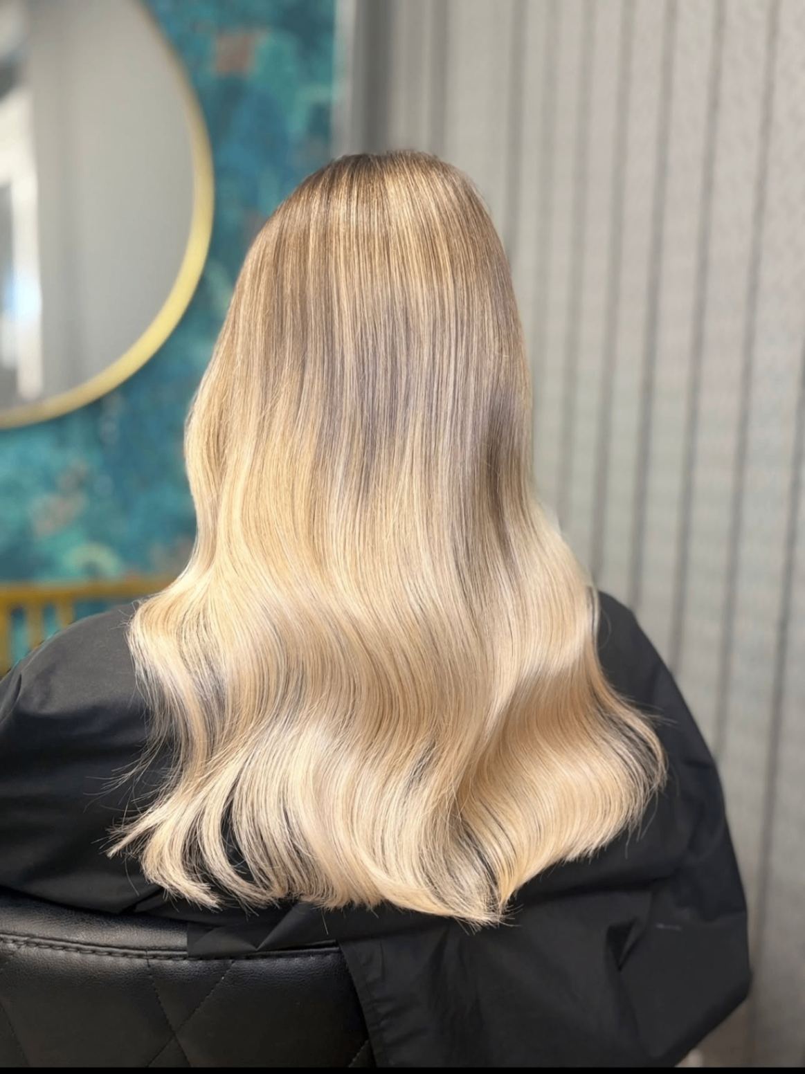 Back view of glossy blonde extensions