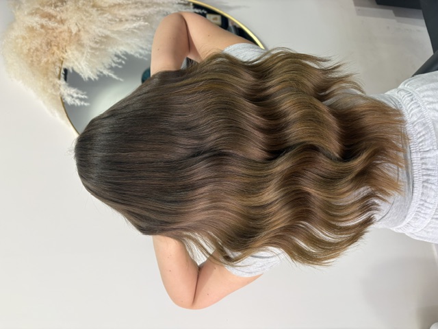Long brunette waves with seamless nano bond extensions