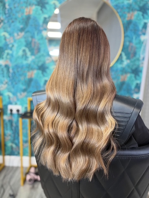 Nano bond hair extensions styled in loose waves